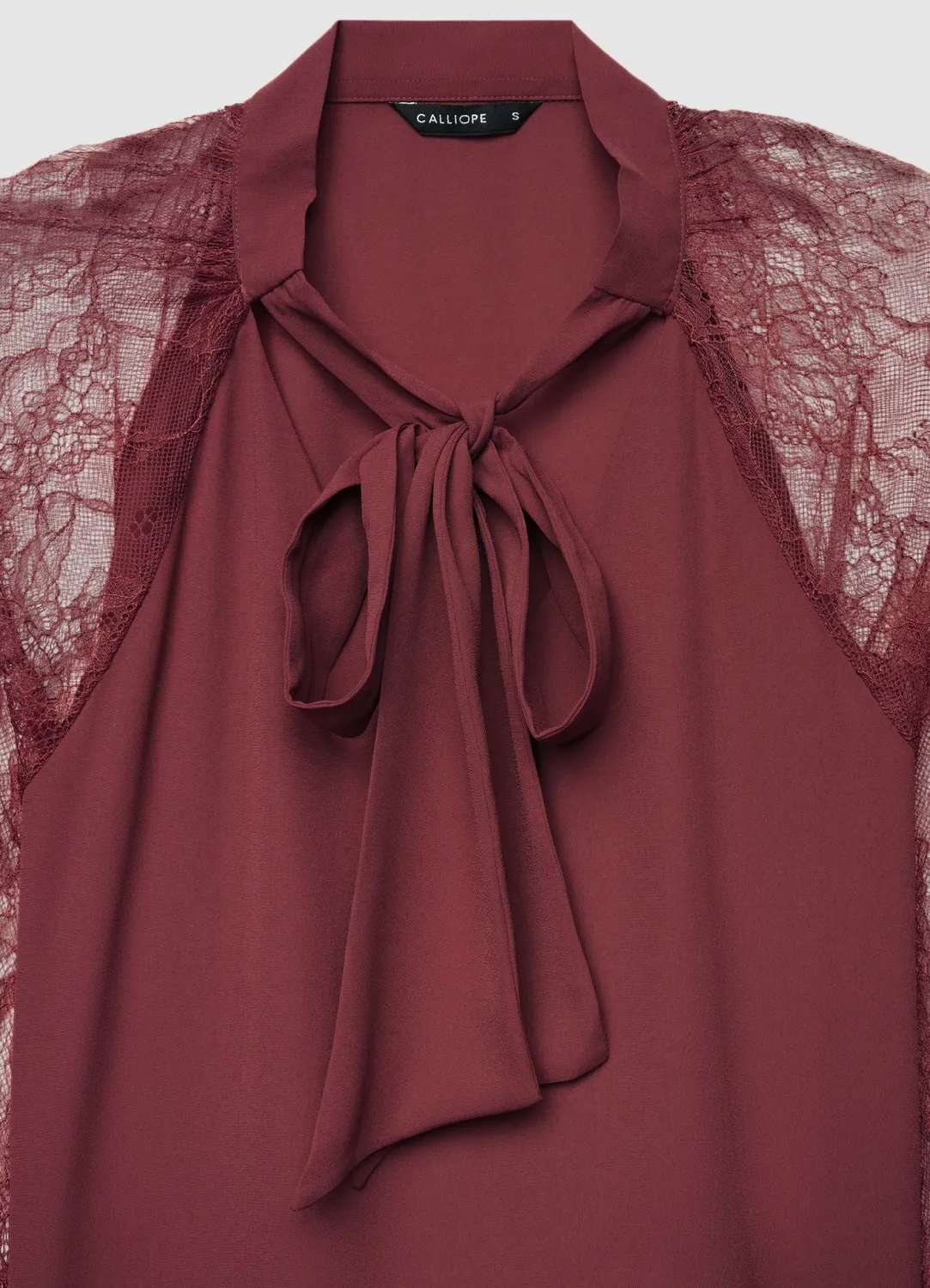 Calliope blouse nœud dentelle femme unie